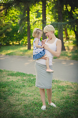 Image showing Mother with baby at outdoor