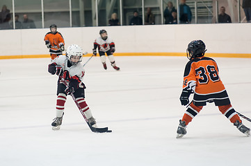 Image showing Game between children ice-hockey teams