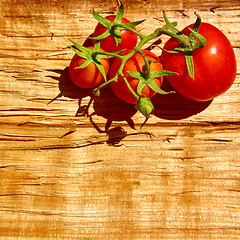 Image showing Fresh tomatoes with on wooden table