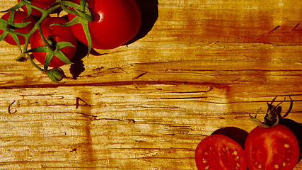 Image showing Fresh tomatoes with on wooden table