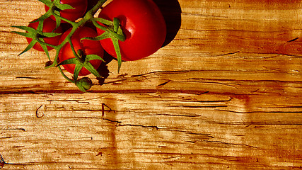 Image showing Fresh tomatoes with on wooden table