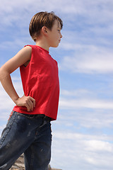 Image showing Boy against blue cloudy sky