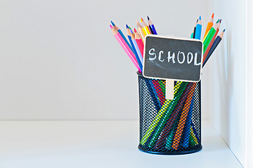 Image showing Pencils in a holder on the light-coloured shelf