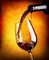 Image showing Red wine on orange background