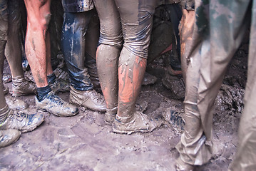 Image showing Teams storm wall in extrim race. Feet view