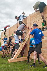 Image showing Teams storm wall in mixed extrim race