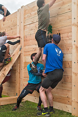 Image showing Teams storm wall in mixed extrim race