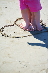 Image showing mom and baby on beach  have fun