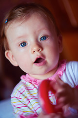 Image showing baby playing with toys at home