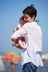 Image showing mom and baby on beach  have fun