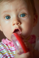 Image showing baby playing with toys at home