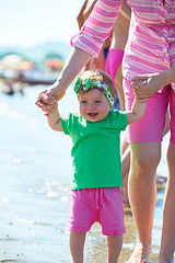 Image showing mom and baby on beach  have fun