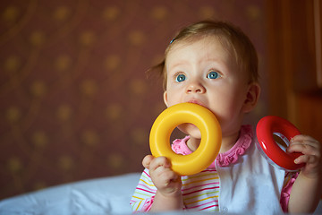 Image showing baby playing with toys at home