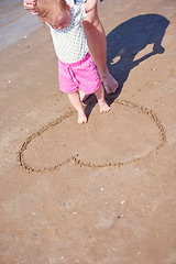 Image showing mom and baby on beach  have fun