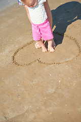 Image showing mom and baby on beach  have fun