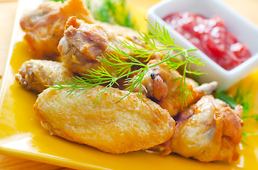 Image showing Hot Meat Dishes - Grilled Chicken Wings with Red Spicy Sauce