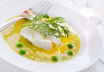 Image showing Fresh soup from green peas and egg-poached