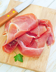 Image showing Proscuitto on a wooden board