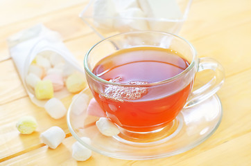 Image showing Fresh tea with candy