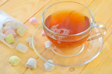 Image showing Fresh tea with candy