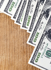 Image showing dollars on wood