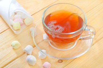 Image showing Fresh tea with candy