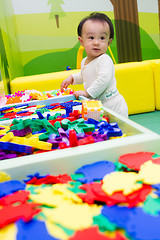 Image showing Chinese baby playing puzzle