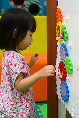 Image showing Chinese girl solving puzzle