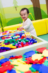 Image showing Chinese baby playing puzzle