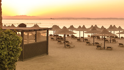 Image showing Tropical beach huts at sunrise