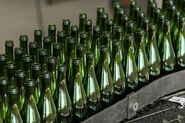 Image showing Many bottles on conveyor belt