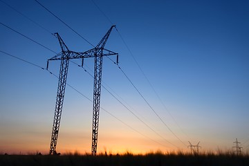 Image showing Large transmission towers at blue hour 