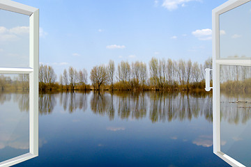 Image showing opened window to the flood river