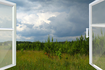 Image showing opened window to summer field before thunder 