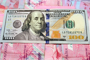 Image showing a hundred dollars on grivnas bank notes