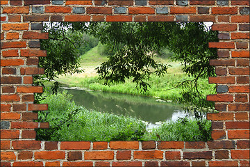 Image showing hole in the brick wall and view to summer river