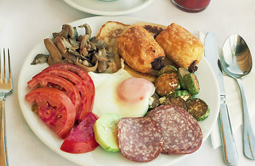 Image showing Sausage and scrambled eggs with owoseni on the plate.