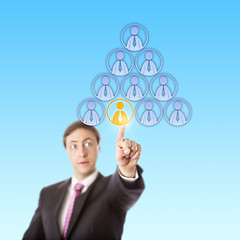 Image showing Focused Manager Selecting A Worker In A Pyramid