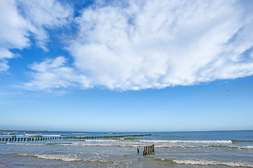 Image showing beach of the Baltic Sea with old wooden wavebreakers