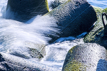 Image showing wave-breaker with spindrift