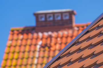 Image showing Red, new roofs tiles of a roof