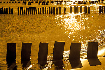 Image showing Sunrise over the Baltic Sea with groins