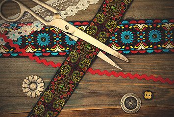 Image showing vintage scissors, antique ribbons and classic buttons