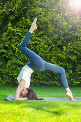 Image showing beautiful adult woman doing yoga at summer morning