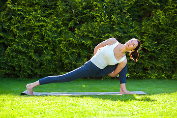 Image showing pretty adult woman practicing yoga