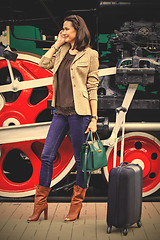 Image showing beautiful adult woman traveler on the platform near the old stea