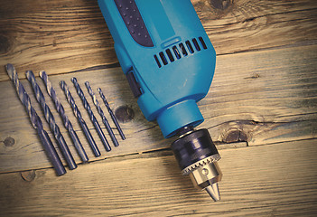 Image showing electric drill with a set of drill bits