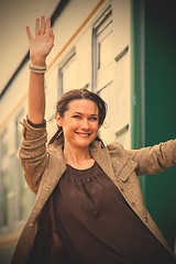 Image showing woman waving hand from the passenger wagon