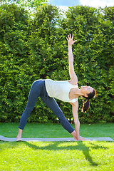 Image showing beautiful adult woman doing yoga