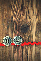 Image showing old red tape and two vintage classic buttons
